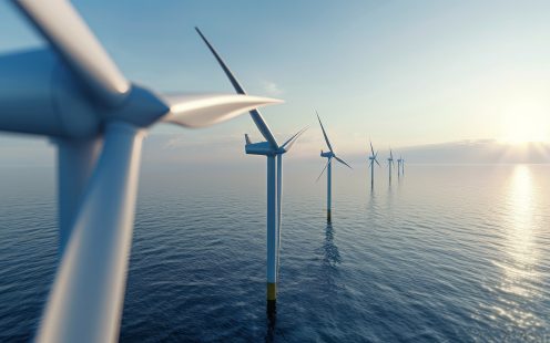 Windmill park in the ocean, drone aerial view of windmill turbines generating green energy electric, windmills isolated at sea. High quality 4k footage. High quality photo